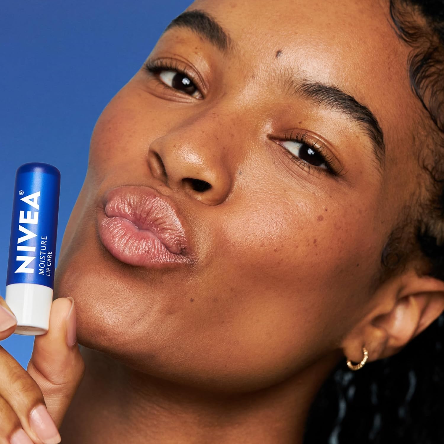 NIVEA_Moisture_Lip_Care,_Hydrating_Lip_Balm_with_Shea_Butter,_Nourishing_Oils_and_Vitamin_C_&_E,_3-in-1_Moisture,_Repair_and_Nourish,_0.17_Oz_Stick,_Pack_of_4