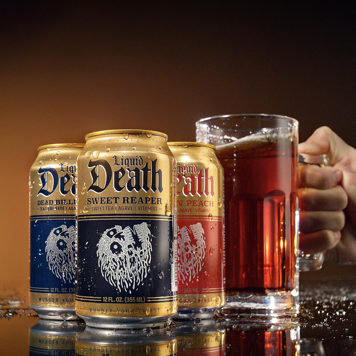Liquid_Death_Iced_Tea_-_Dead_Billionaire_(Black_Tea/Lemonade),_Less_Sugar*,_Boost_of_Caffeine,_B_Vitamins,_No_Artificial_Sweeteners,_12_Fl_Oz_(Pack_of_12)